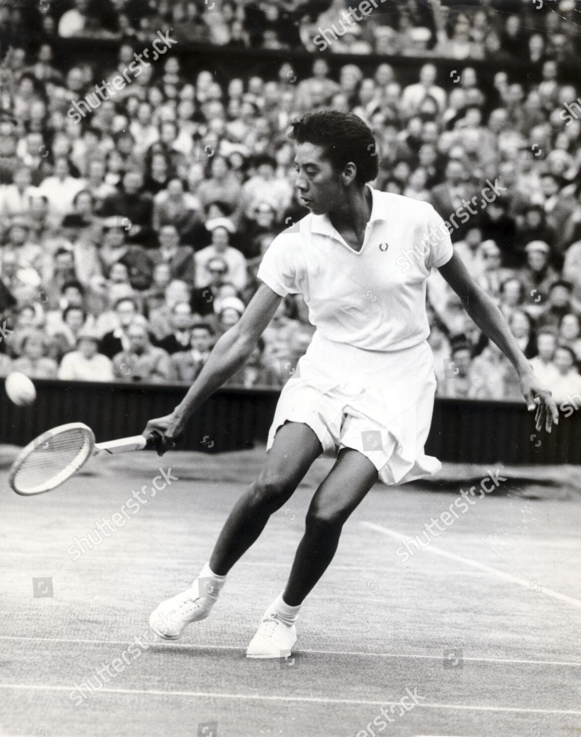 althea-gibson-coloured-american-tennis-player-in-action-at-wimbledon-july-1956-shutterstock-editorial-8993690a.jpg
